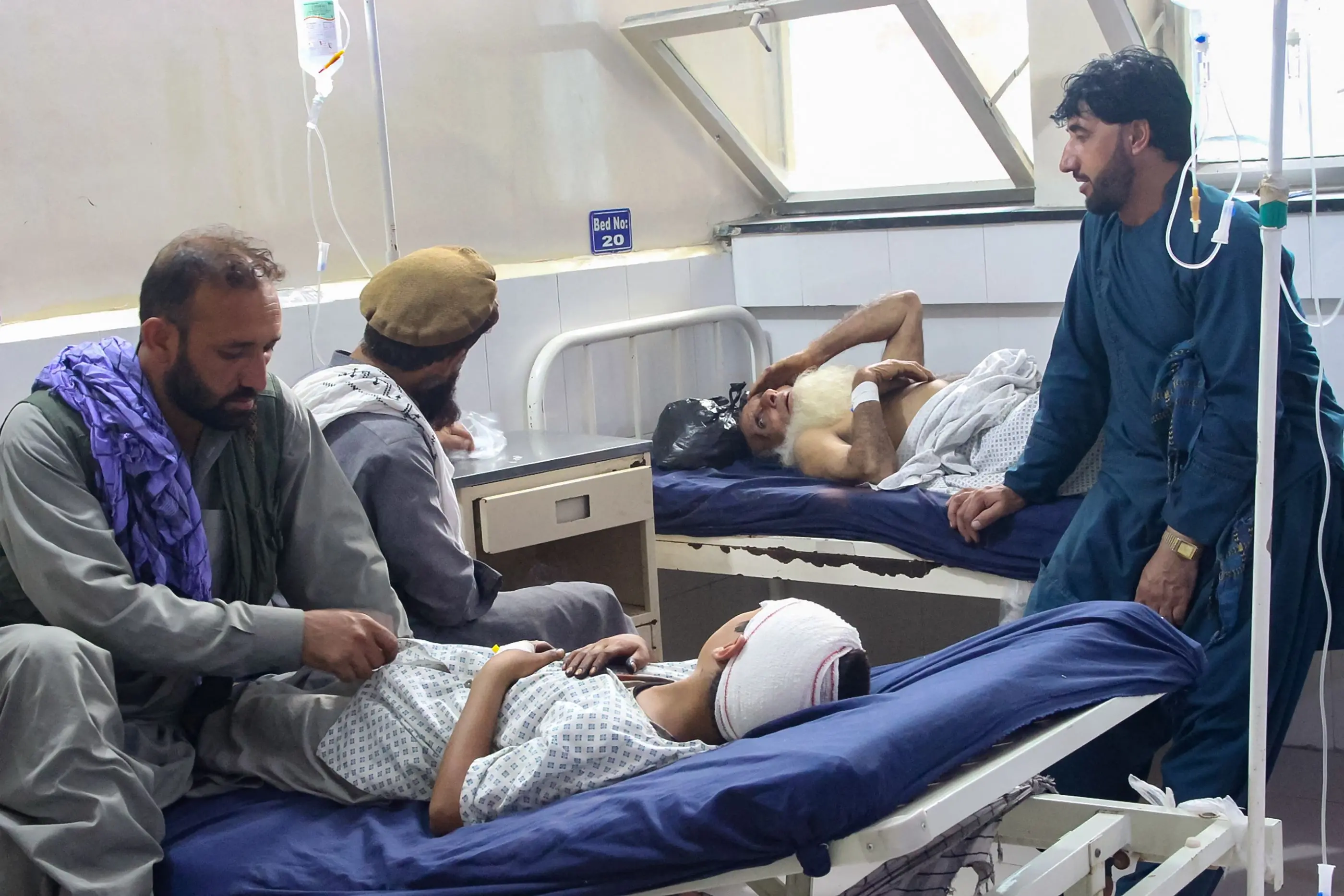 Injured Afghan people receive treatment at a hospital after an earthquake in Afghanistan's Jalalabad | AFP
