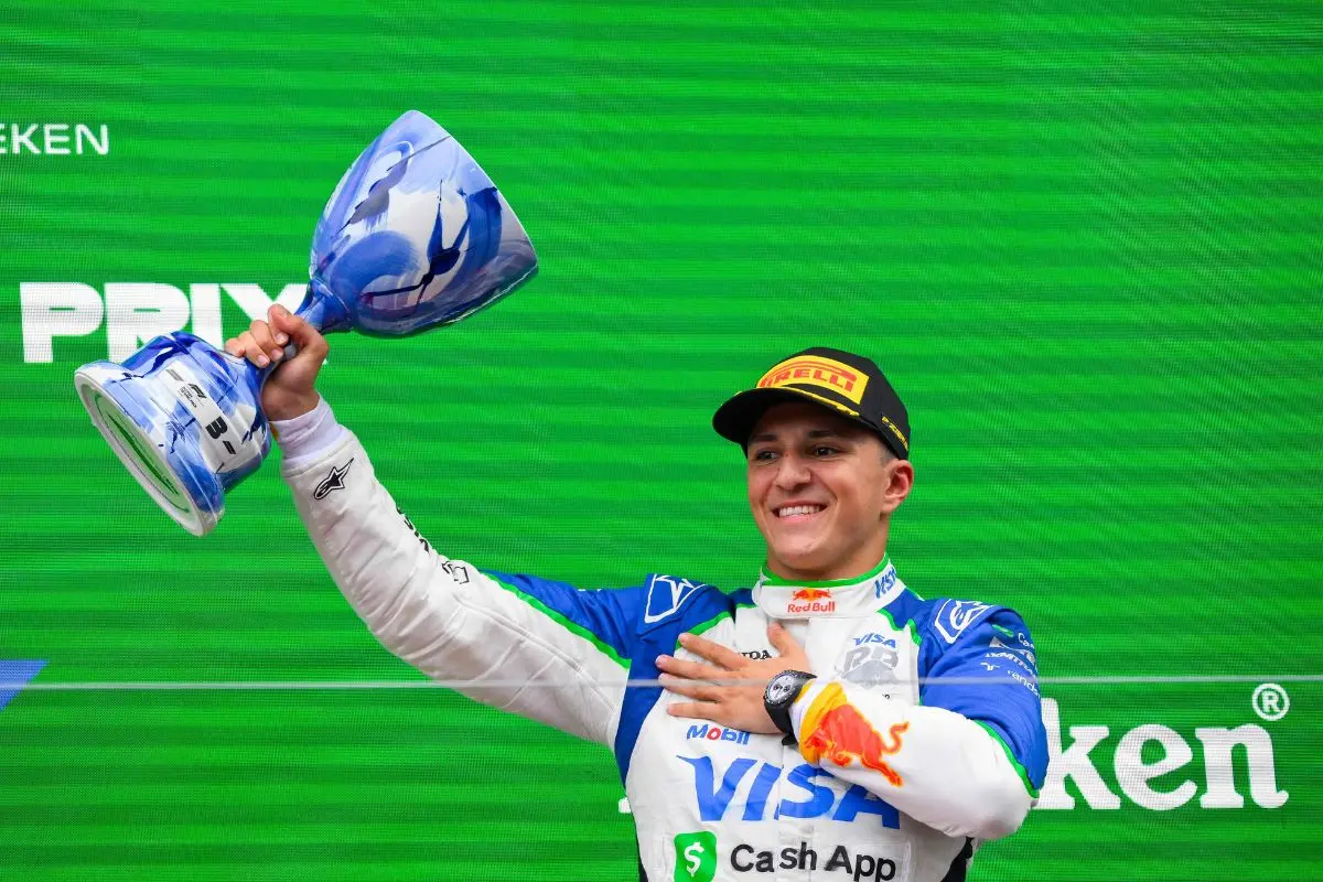 Third-placed RB's French driver Isack Hadjar celebrates on the podium following the Formula One Dutch Grand Prix  | Photo: AFP