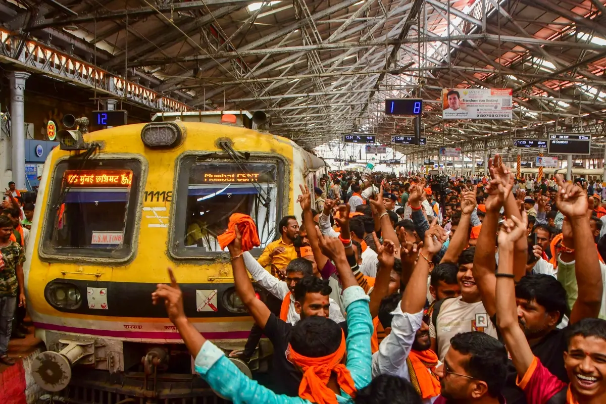 Maratha community members stop a train during their protest seeking reservation for the community under the Other Backward Classes (OBC) category, at Chhatrapati Shivaji Maharaj Terminus (CSMT) in Mumbai | Photo: PTI
