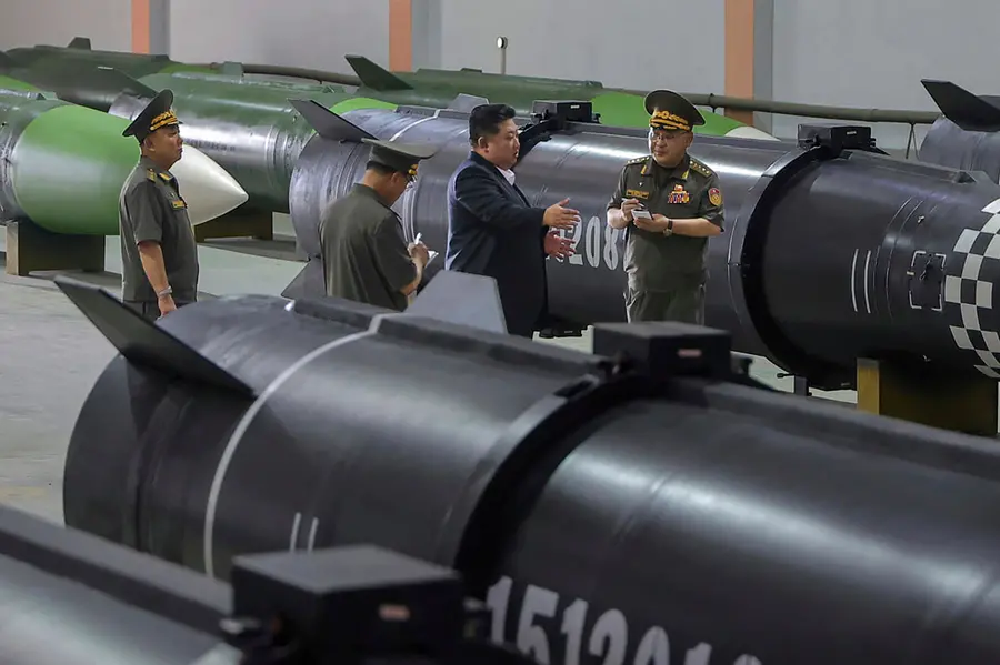 North Korean leader Kim Jong Un inspects a new weapons factory in undisclosed location, North Korea on Aug. 31