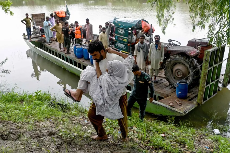 Flood-affected victims are evacuated from Kasur district in Punjab province | AFP