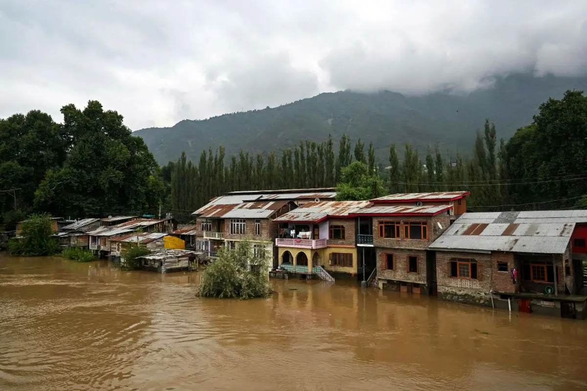 Partially submerged houses are pictured along the banks of the river Jhelum following heavy rains in Srinagar. Photograph: Tauseef Mustafa/AFP