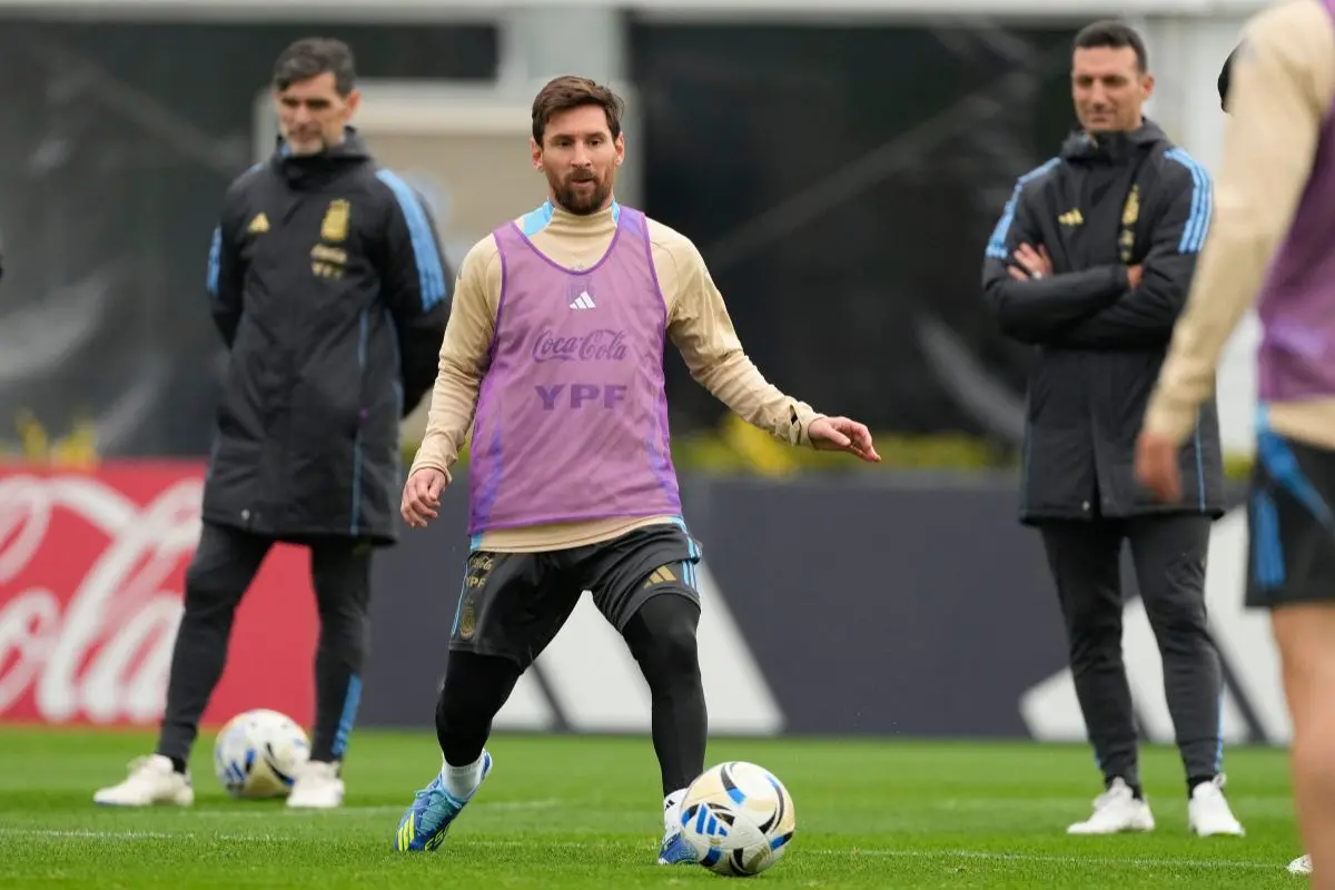 Argentina's Lionel Messi passes the ball during a training session ahead of a World Cup 2026 qualifying soccer match against Venezuela, at the Argentina Soccer Association in Buenos Aires, Argentina. | Photo: AP