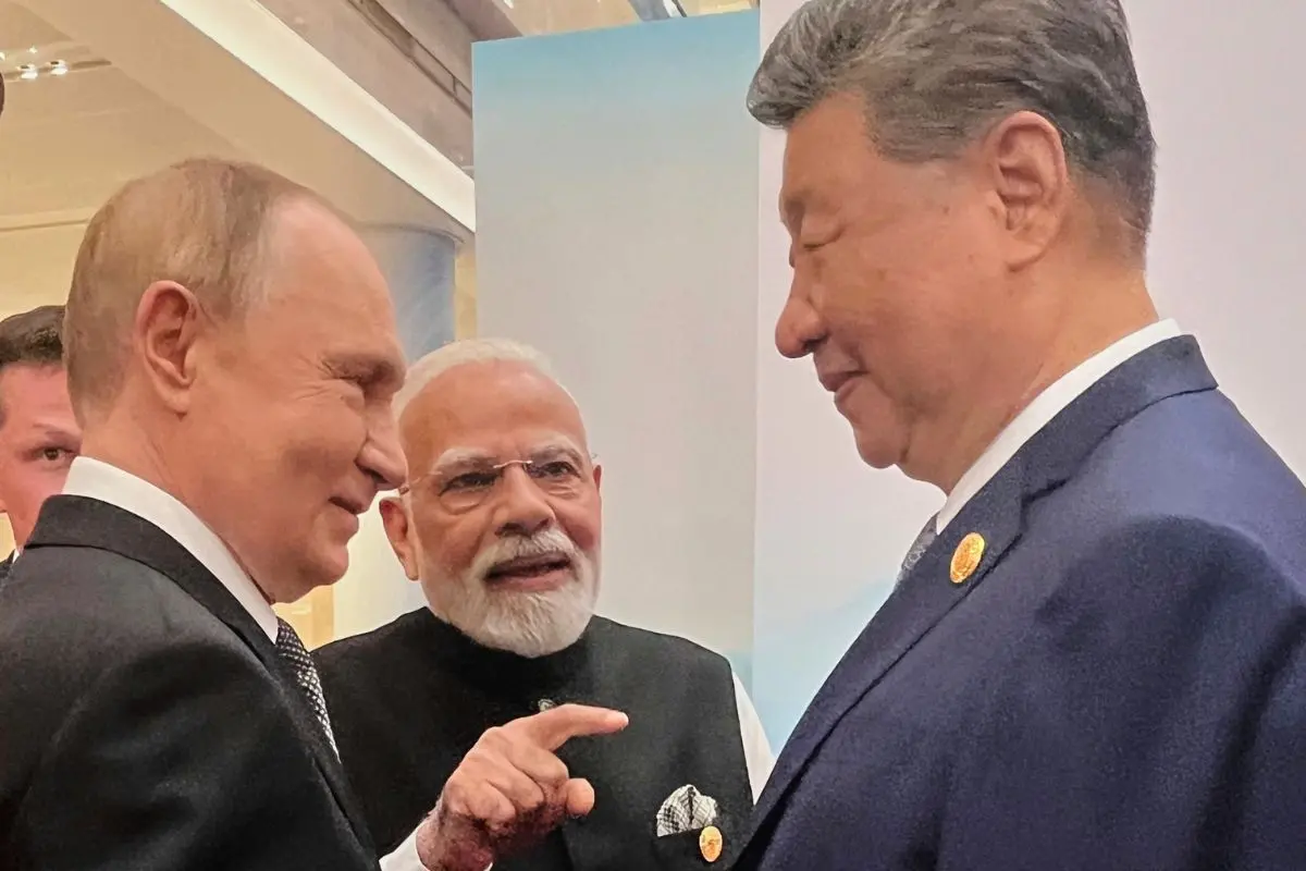 File Photo: Russian President Vladimir Putin, from left, Indian Prime Minister Narendra Modi and Chinese President Xi Jinping talk ahead of the Shanghai Cooperation Organization (SCO) summit | AP