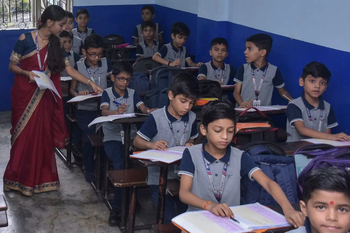 A student plays the role of a teacher in a classroom at Gyanganga Vidhyalaya School on the eve Teachers' Day in Surat on Thursday. (ANI Photo)