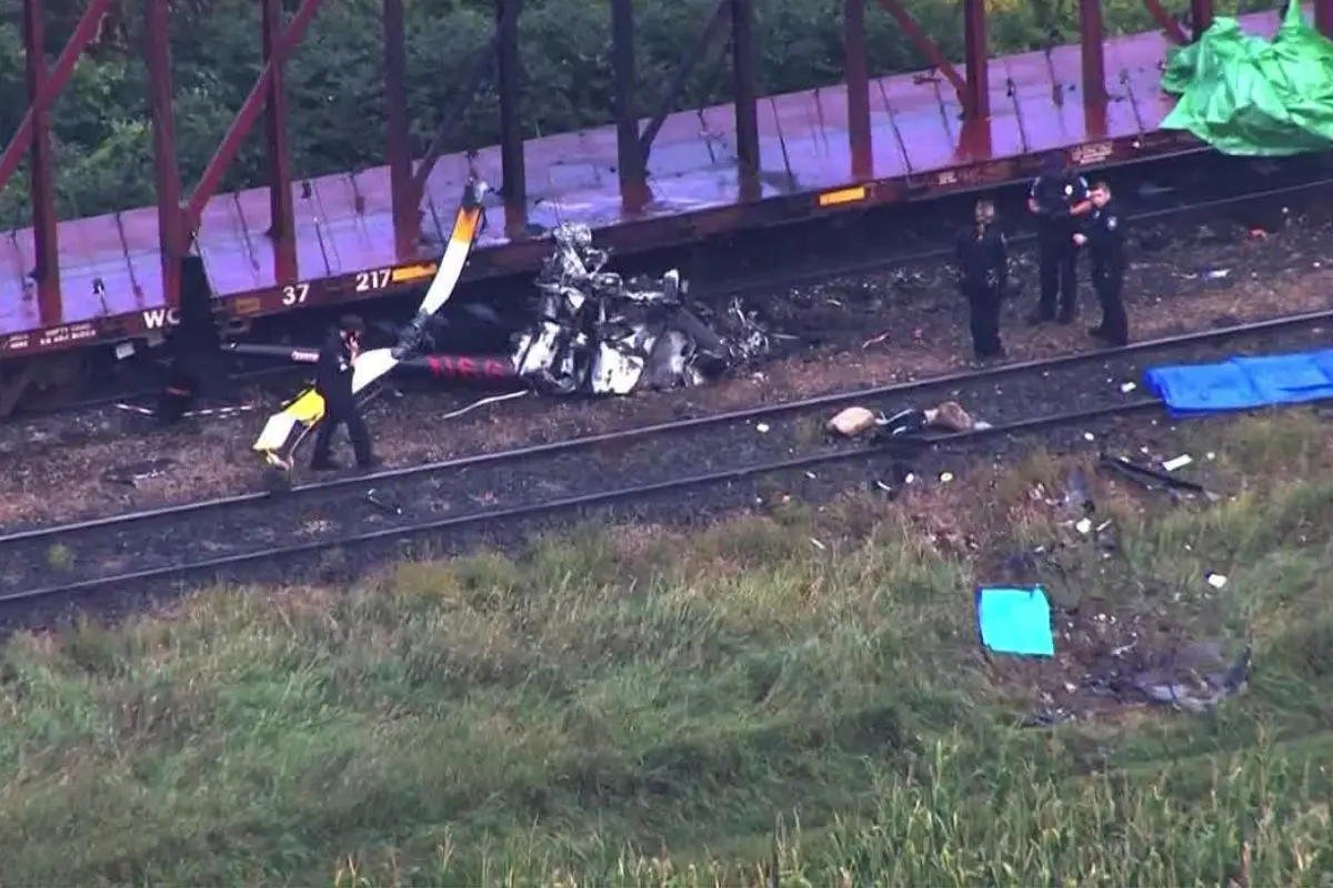 Wreckage of the Robinson R66 helicopter smolders after crashing in a rural area near Lakeville, Minnesota, on Saturday afternoon. Authorities confirmed no one on board survived. Photo: X