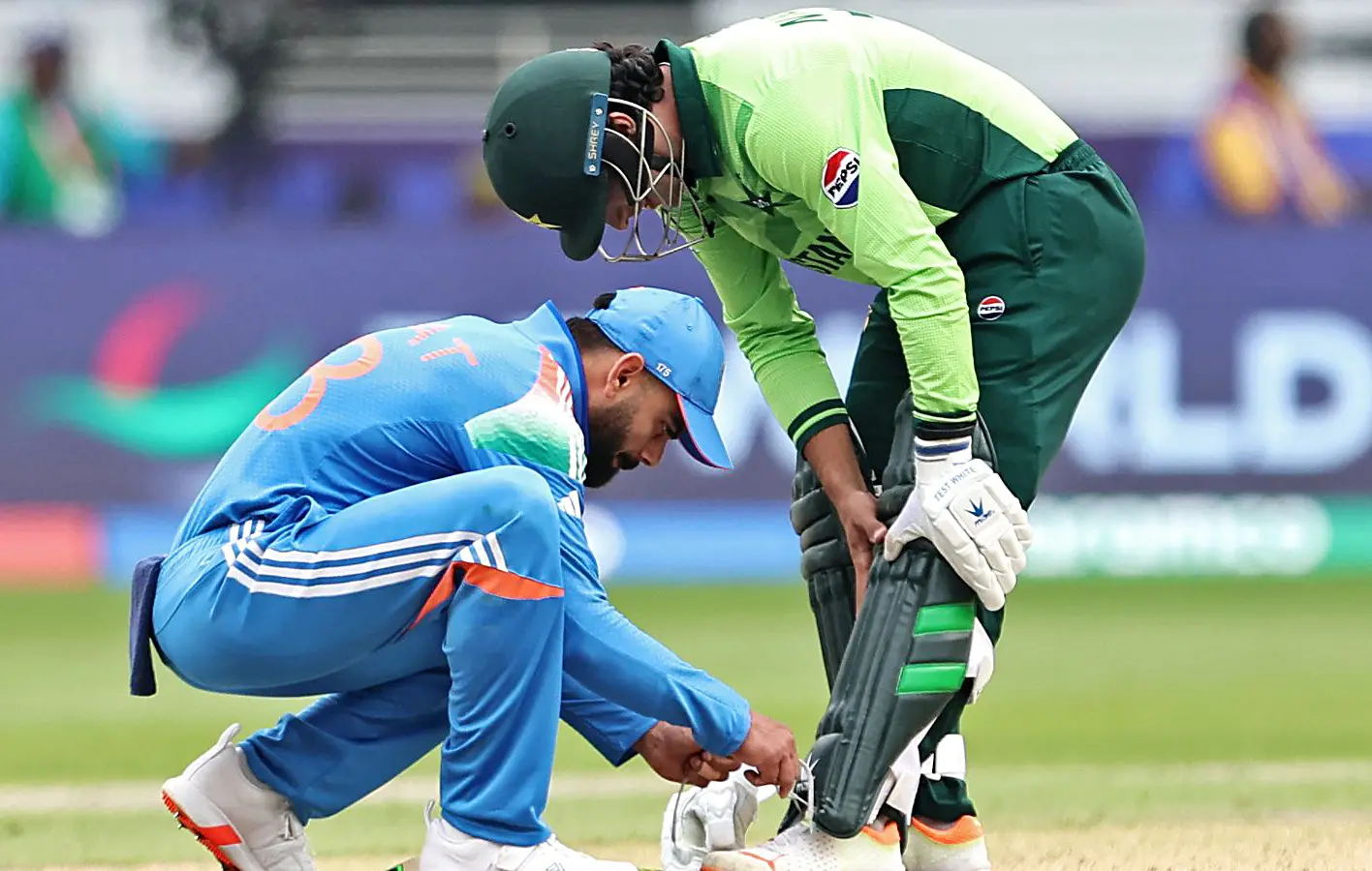 India's Virat Kohli ties the shoelaces of Pakistan's Naseem Shah during their ICC Champions Trophy 2025 at Dubai International Cricket Stadium | File Photo: ANI