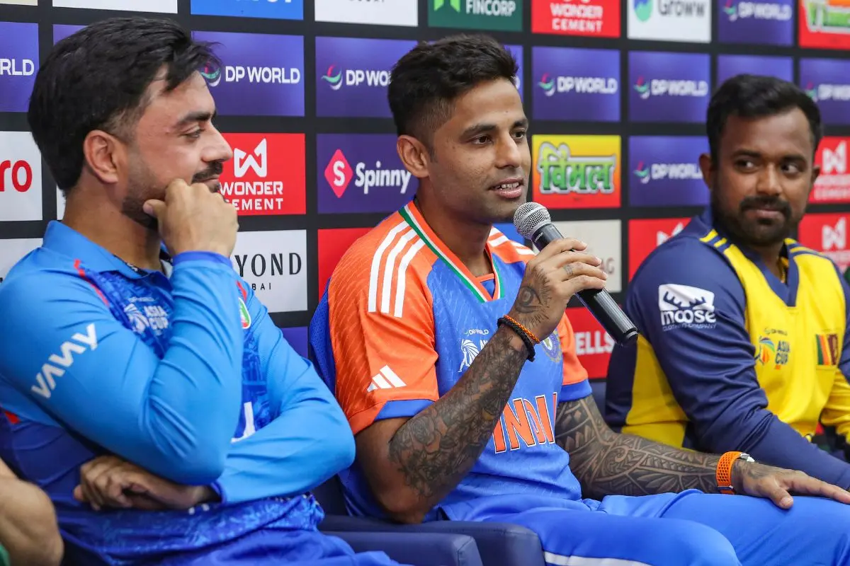 India's captain Suryakumar Yadav addresses the media during the unveiling of the Asia Cup 2025 trophy, in Dubai. Afghanistan's captain Rashid Khan, left, and Sri Lanka's captain Charith Asalanka, right, are also seen. | Photo: PTI