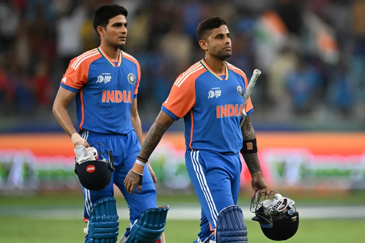ndia's captain Suryakumar Yadav (R) walks along with his teammate Shubman Gill after winning the Asia Cup 2025 Twenty20 international cricket match between United Arab Emirates and India at the Dubai International Stadium in Dubai. | Photo: AFP