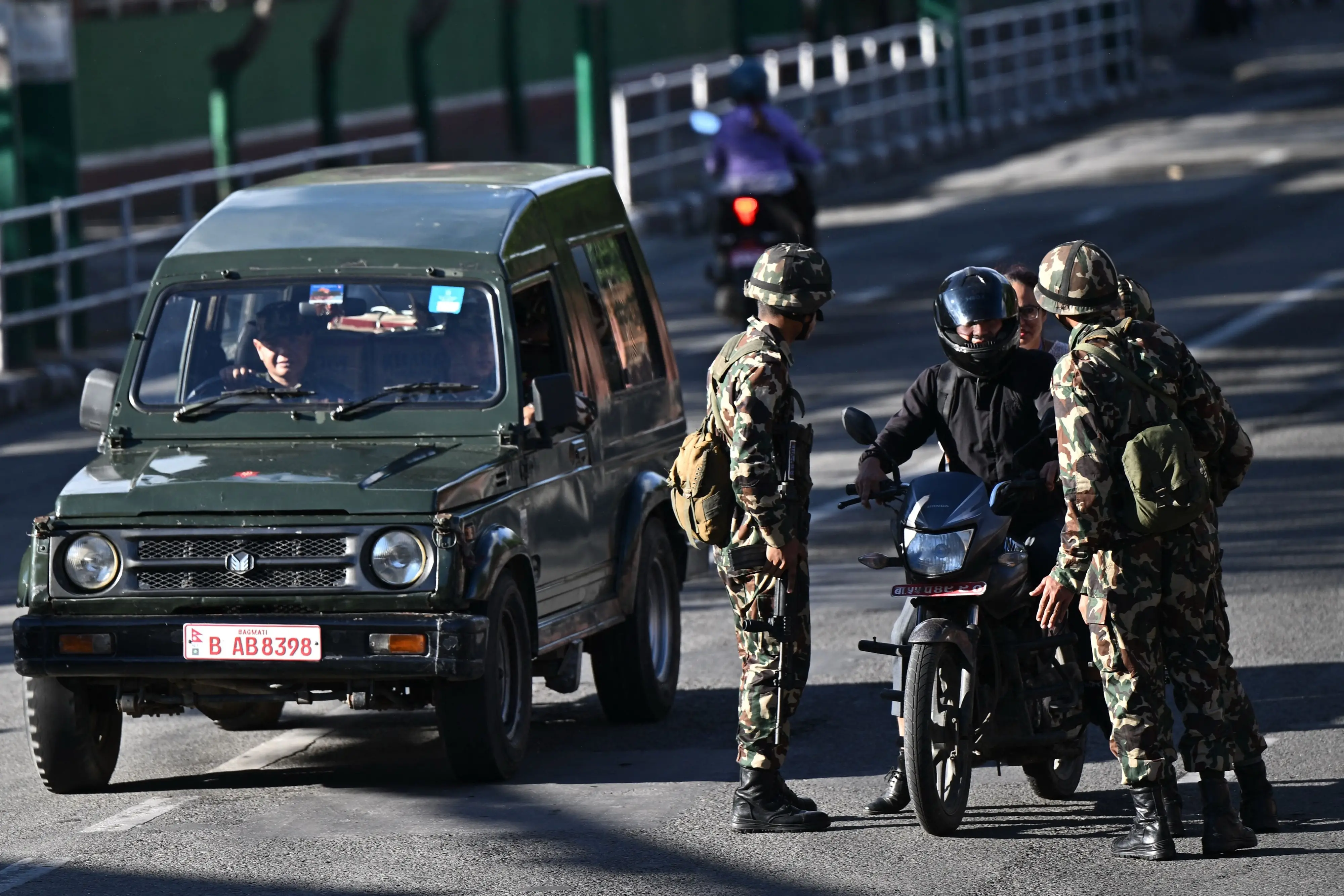 Army personnel keep watch along a street during a curfew imposed to restore law and order in Kathmandu | Photo: AFP