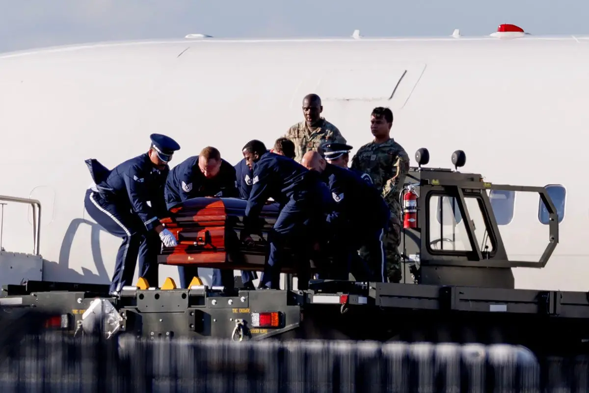 The casket containing the body of Charlie Kirk is removed from Air Force Two at Phoenix Sky Harbor International Airport on September 11 (Photo: AFP)