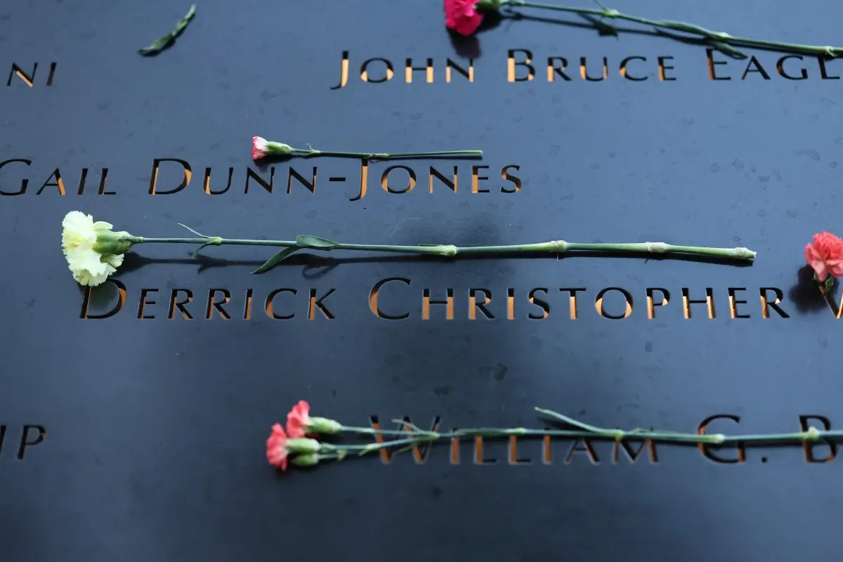 File photo | Flowers are seen on the names of victims of the 9/11 terror attack on the South Tower