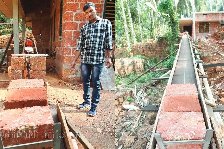 വീടുപണിക്ക് ചുമട്ടുകൂലി ലാഭിക്കാൻ യുവാവിന്റെ സൂത്രം; ശ്രദ്ധ നേടി 'വണ്ടിപ്പാലം'