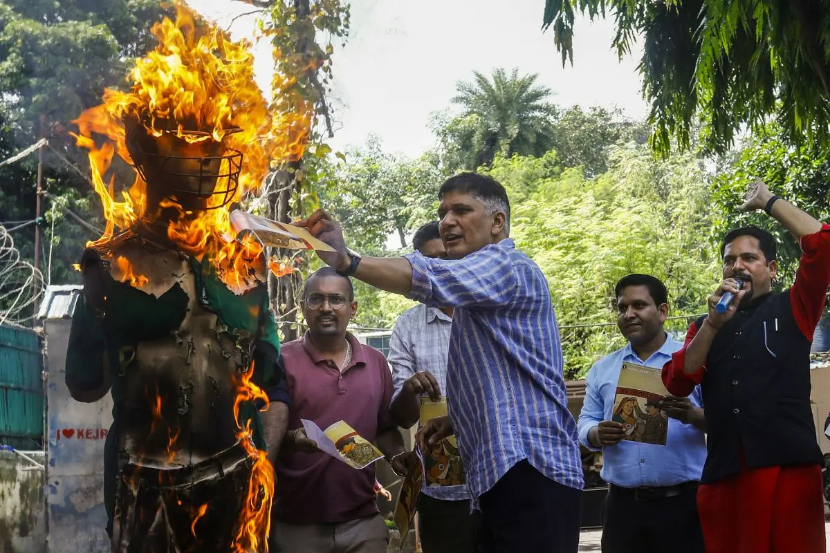 AAP leader Saurabh Bharadwaj burns an effigy during a protest against the upcoming Asia Cup cricket match between India and Pakistan | Photo: PTI