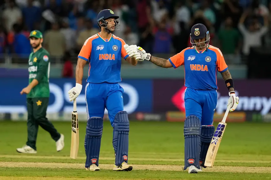 India's captain Suryakumar Yadav, right, celebrates with batting partner Shivam Dube after their win in the Asia Cup cricket match against Pakistan at Dubai International Cricket Stadium in Dubai