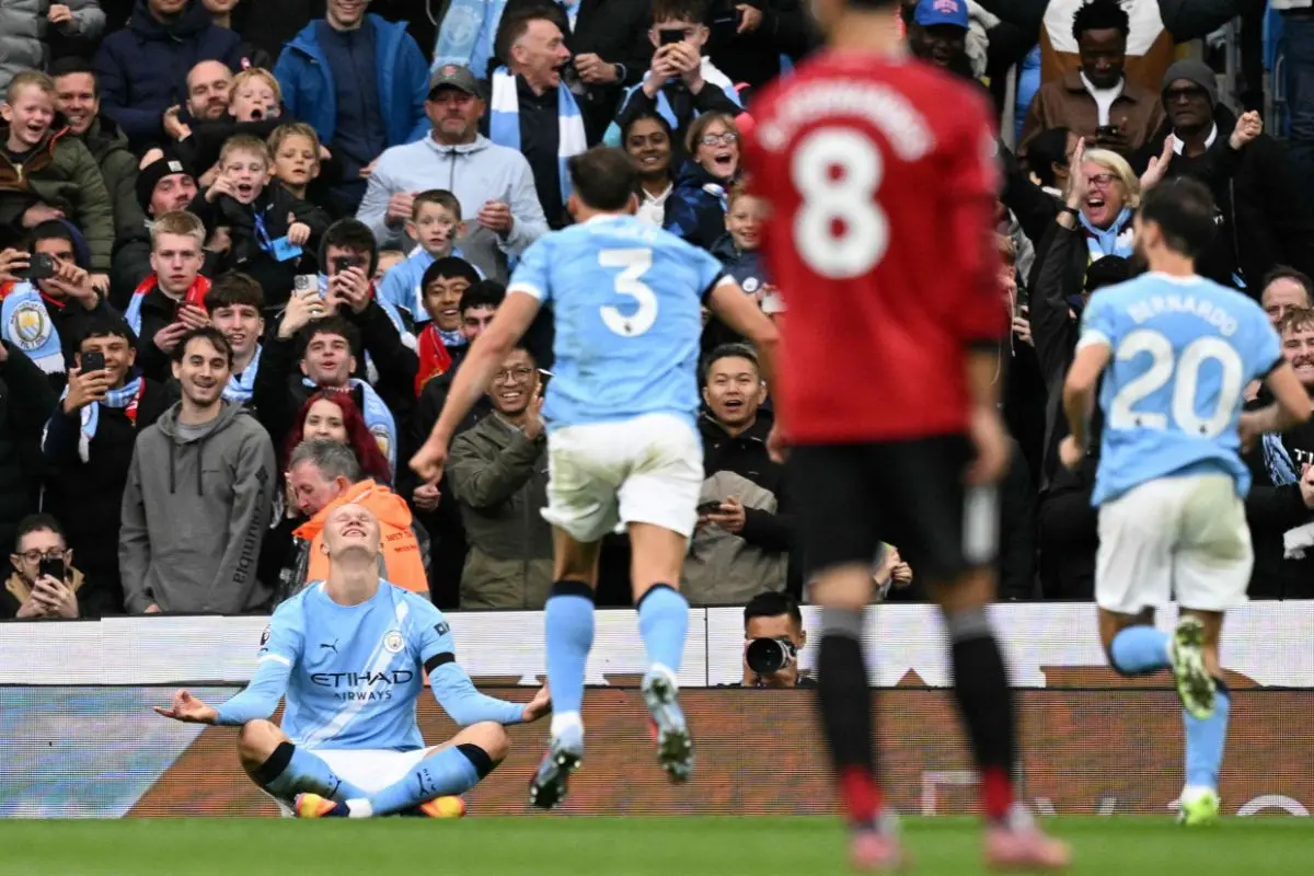 Manchester City's Norwegian striker #09 Erling Haaland (L) celebrates scoring their third goal during the English Premier League football match between Manchester City and Manchester United | Photo: AFP