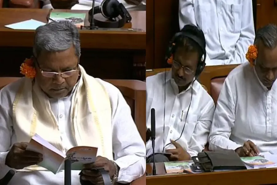 'ജനങ്ങളെ വിഡ്ഢികളാക്കുന്നു'; ബജറ്റവതരണ ദിവസം ചെവിയില് പൂവെച്ചെത്തി കര്ണാടക കോണ്ഗ്രസ് MLAമാര്