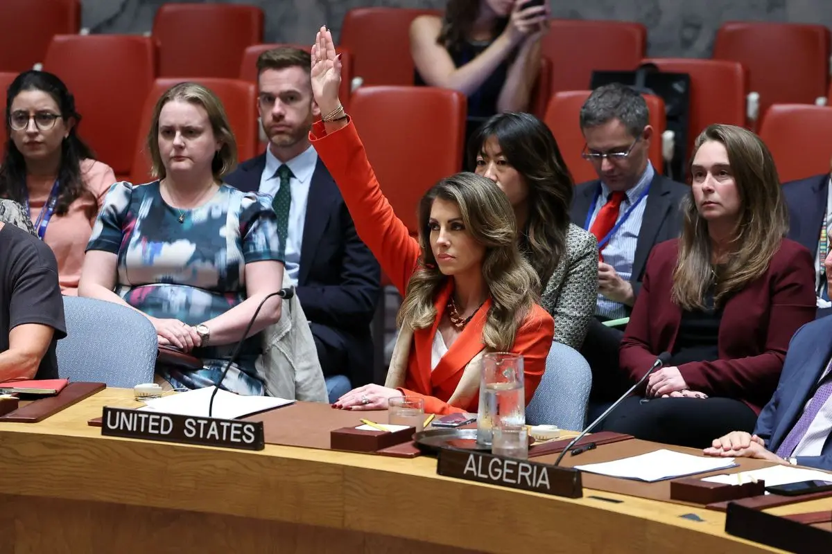 US deputy Middle East envoy Morgan Ortagus (C) raises her hand to veto a draft resolution during a United Nations Security Council meeting on the situation in Gaza, at UN headquarters in New York | Photo: AFP