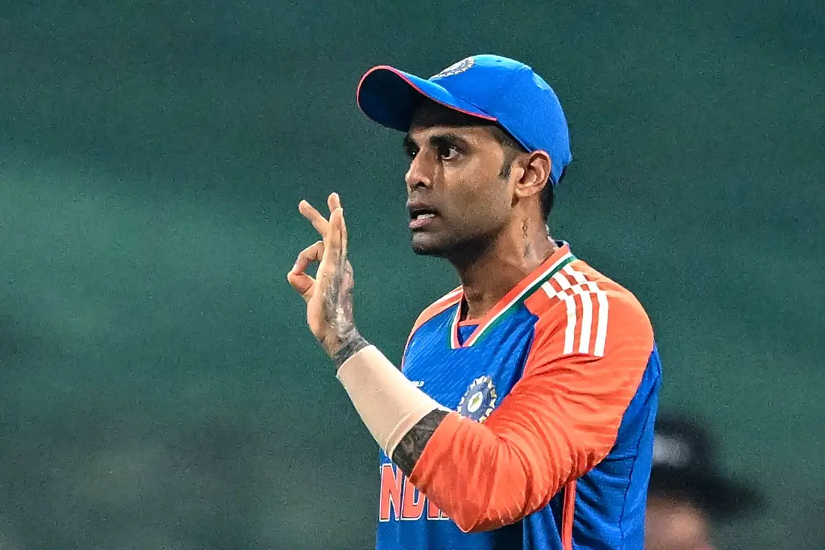 India's captain Suryakumar Yadav speaks with the field umpire Faisal Afridi during the Asia Cup 2025 Twenty20 international cricket match between India and Oman at the Sheikh Zayed Cricket Stadium in Abu Dhabi. | Photo: AFP