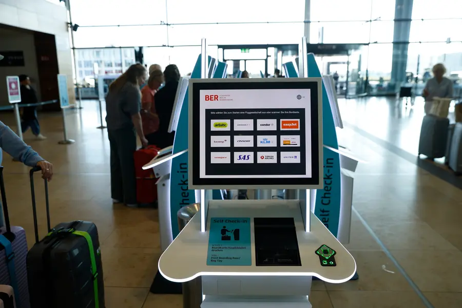 People at BER airport as a cyber attack has caused delays, in Berlin, Germany, Saturday, Sept. 20, 2025. (Carsten Koall/dpa via AP)