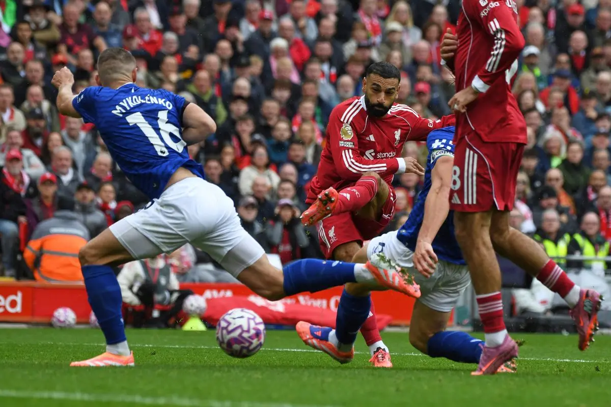 Liverpool's Mohamed Salah, centre, makes an attempt to score past Everton's Vitaliy Mykolenko during the English Premier League soccer match between Liverpool and Everton | Photo: AP