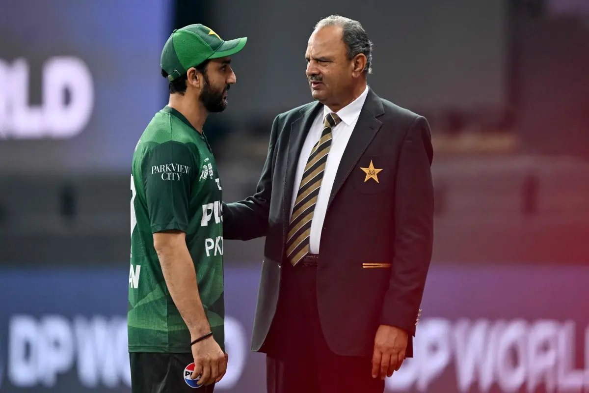 Pakistan's captain Salman Agha (L) engaed in a conversation with team manager Naveed Akram Cheema. | Photo: PTI