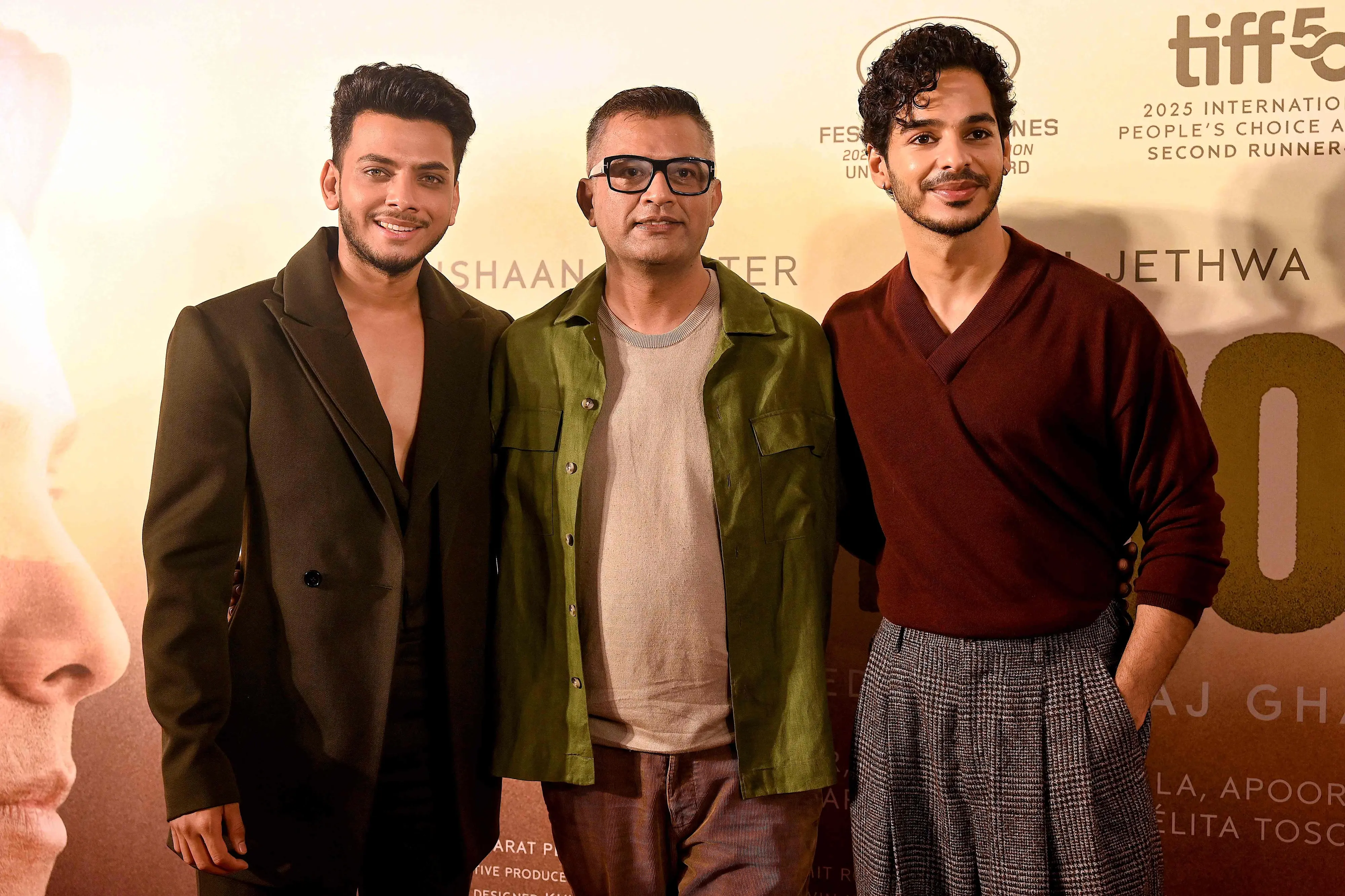 Bollywood actors Vishal Jethwa (L) and Ishaan Khatter (R) pose alongside writer and director Neeraj Ghaywan during a press conference for their upcoming Indian Hindi-language drama film 'Homebound' in Mumbai | AFP