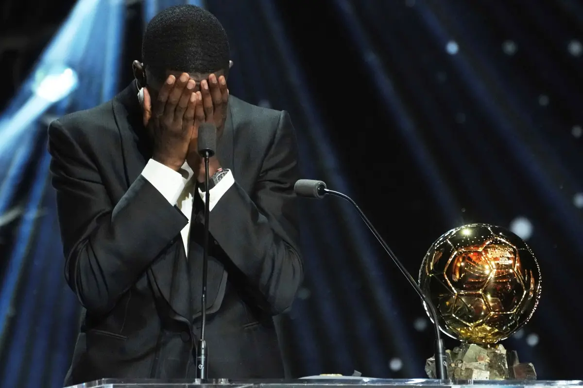 Paris Saint-Germain's Ousmane Demb&eacute;l&eacute; reacts as he receives the 2025 Men's Ballon d'Or during the 69th Ballon d'Or awards ceremony at the Theatre du Chatelet in Paris. | Photo: AP