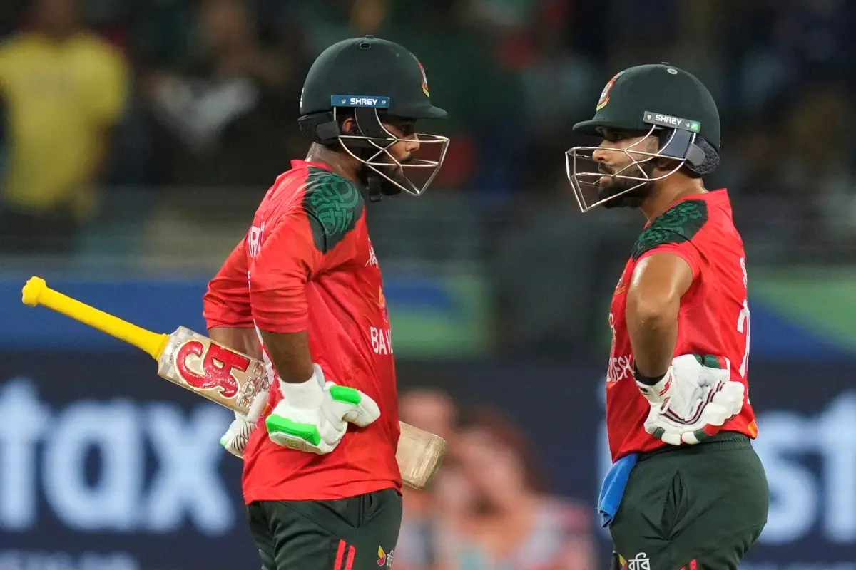 Bangladesh's Towhid Hridoy, left, and batting partner Shamim Hossain chat during the Asia Cup cricket match between Bangladesh and Sri Lanka at Dubai International Cricket Stadium in Dubai, United Arab Emirates. | Photo: AP