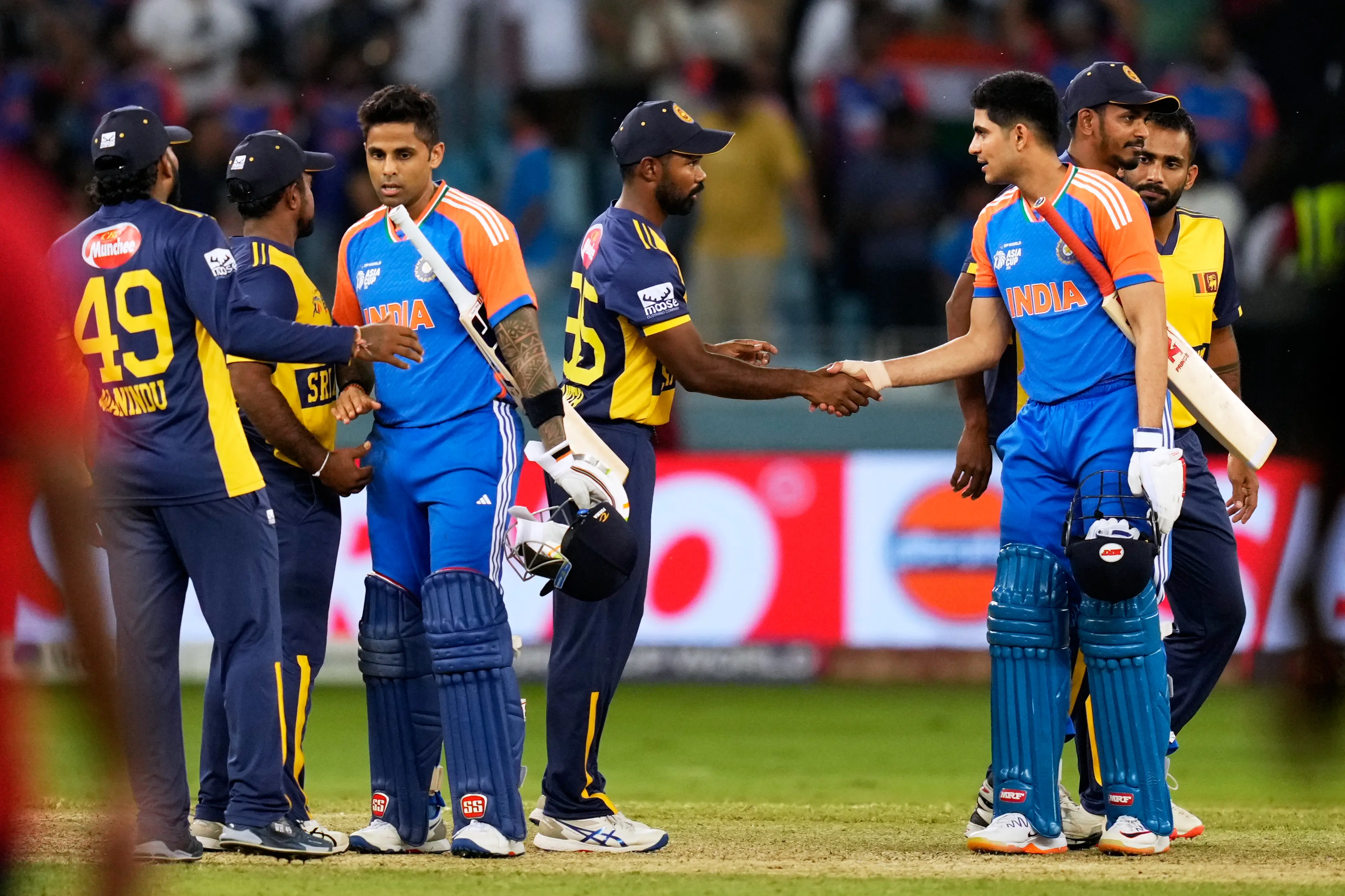 India's captain Suryakumar Yadav, third left, and teammate Shubman Gill shake hands with Sri Lanka's players after winning the Asia Cup cricket match against Sri Lanka at Dubai International Cricket Stadium | Photo: AP