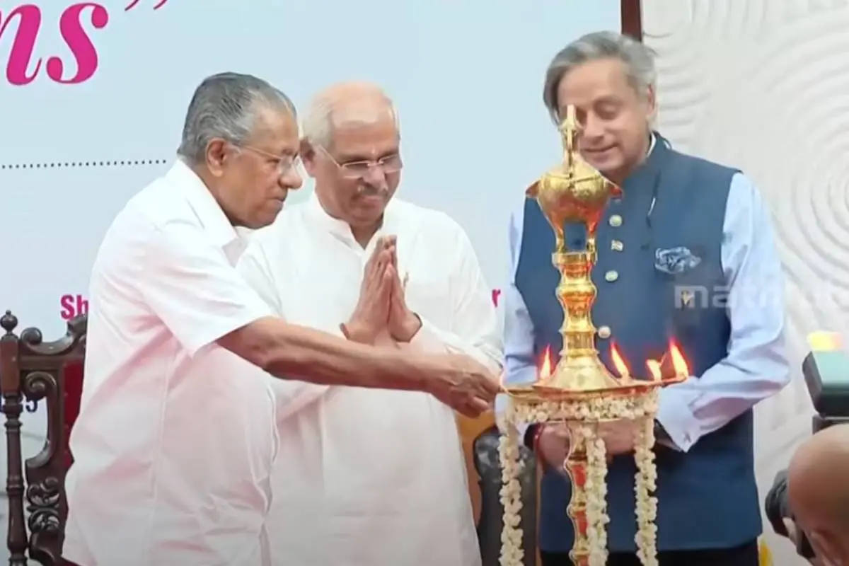 Chief Minister Pinarayi Vijayan inaugurating the official magazine of the Raj Bhavan as Governor Arlekar and MP Shashi Tharoor look on