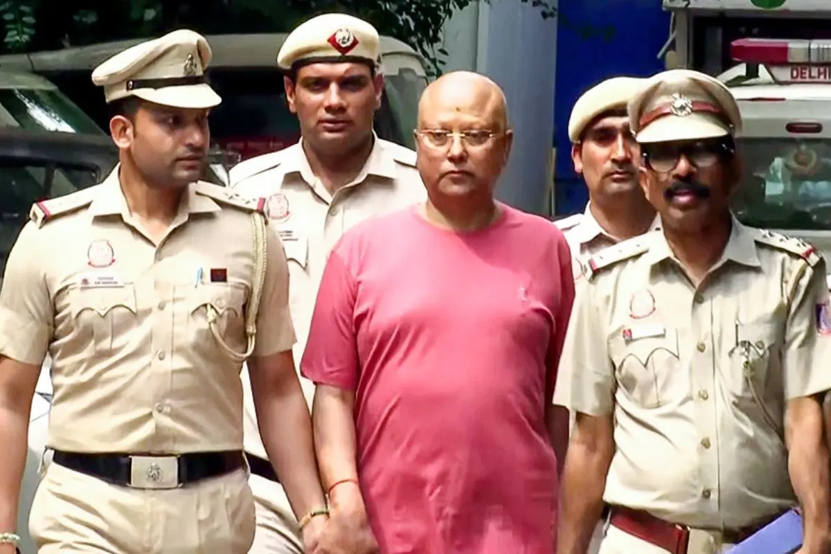 Delhi Police after apprehending Chaitanyananda Saraswati from Agra on Sunday. (ANI Video Grab)