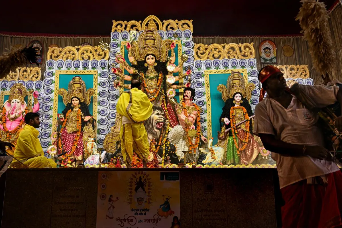 Priests perform rituals on 'Maha Ashtami' at a pandal in Jabalpur, Madhya Pradesh. (PTI Photo)