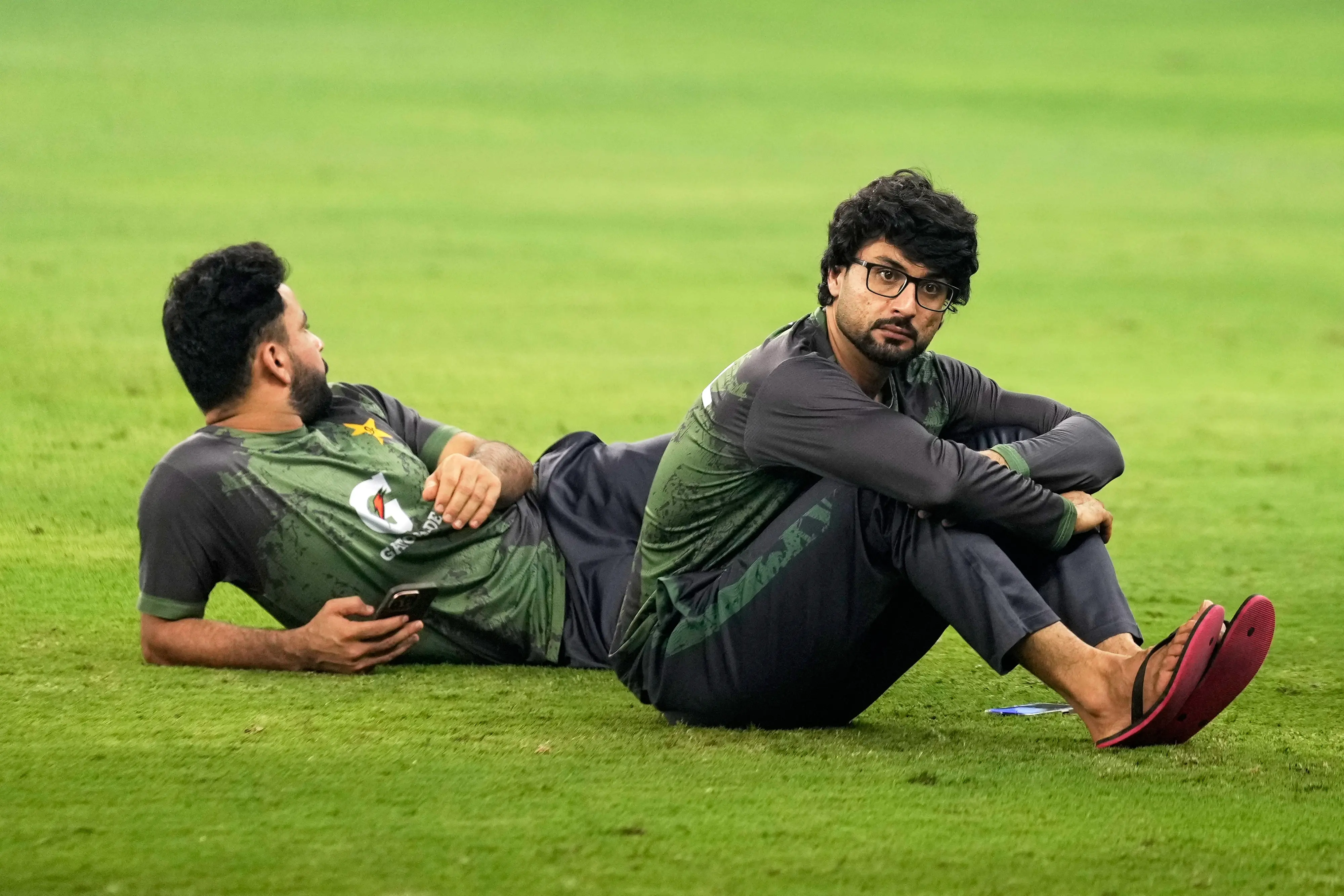 Pakistan's Abrar Ahmed, right, waits for the presentation ceremony after India won the Asia Cup cricket final against Pakistan at Dubai International Cricket Stadium, United Arab Emirates | AP/PTI