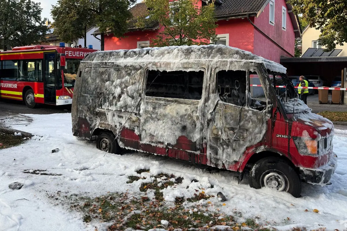 A burned van is covered by extinguishing foam after a fire in Munich, Germany | Photo: AP