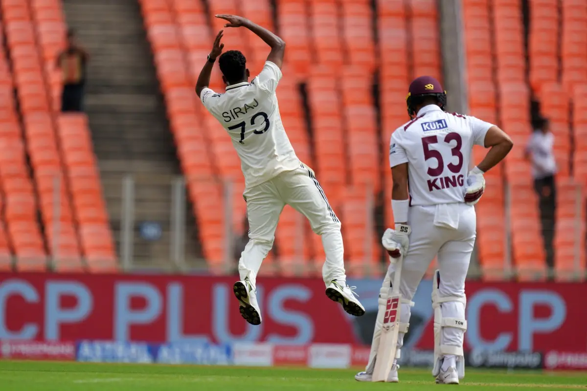 India's Mohammed Siraj, left, celebrates the dismissal of West Indies' Brandon King on the first day of the first Test cricket match between India and West Indies at Narendra Modi Stadium in Ahmedabad. | Photo: AP/PTI