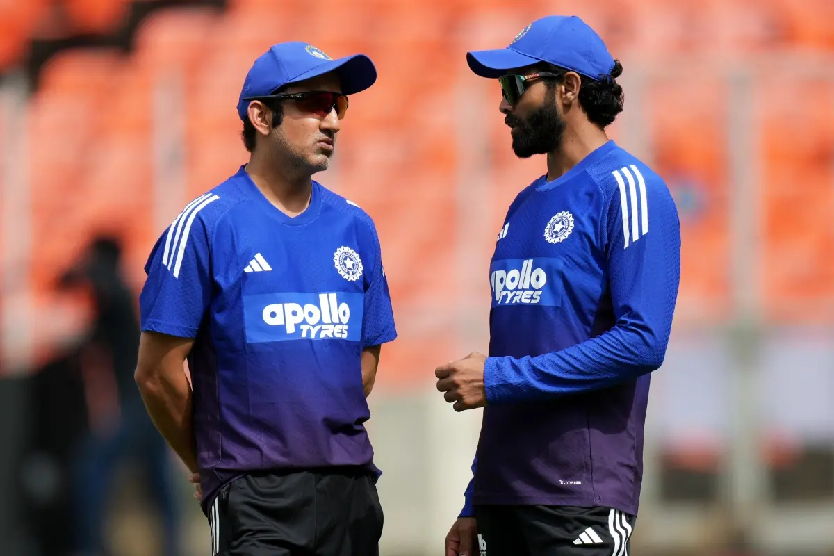 India's head coach Gautam Gambhir, left, talks with Ravindra Jadeja during practice session ahead of the first Test cricket match against West Indies at Narendra Modi Stadium in Ahmedabad. | Photo: AP/PTI