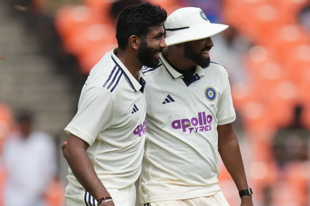 India's Jasprit Bumrah, left, and Mohammed Siraj celebrates the dismissal of West Indies' Johann Layne on the first day of the first Test cricket match between India and West Indies at Narendra Modi Stadium in Ahmedabad | Photo: AP