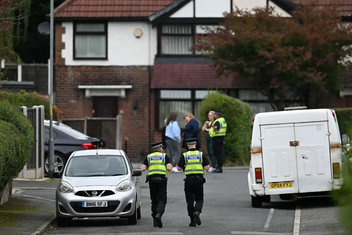 Police officers work on White House Avenue, near to the Heaton Park Hebrew Congregation synagogue (Photo: AFP)