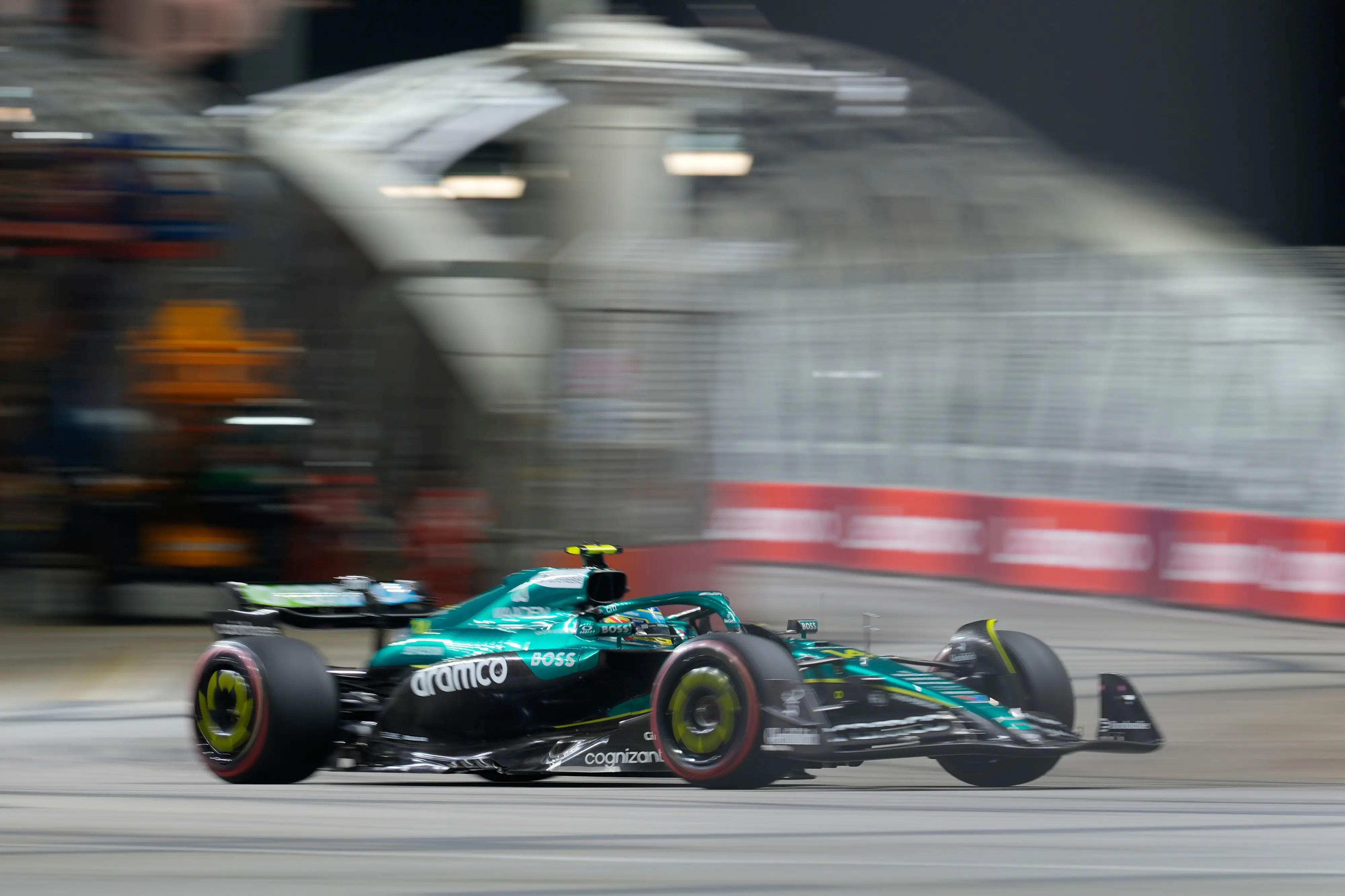 Aston Martin driver Fernando Alonso of Spain steers his car during the second practice session of the Singapore Formula One Grand Prix at the Marina Bay Street Circuit in Singapore. | Photo: AP