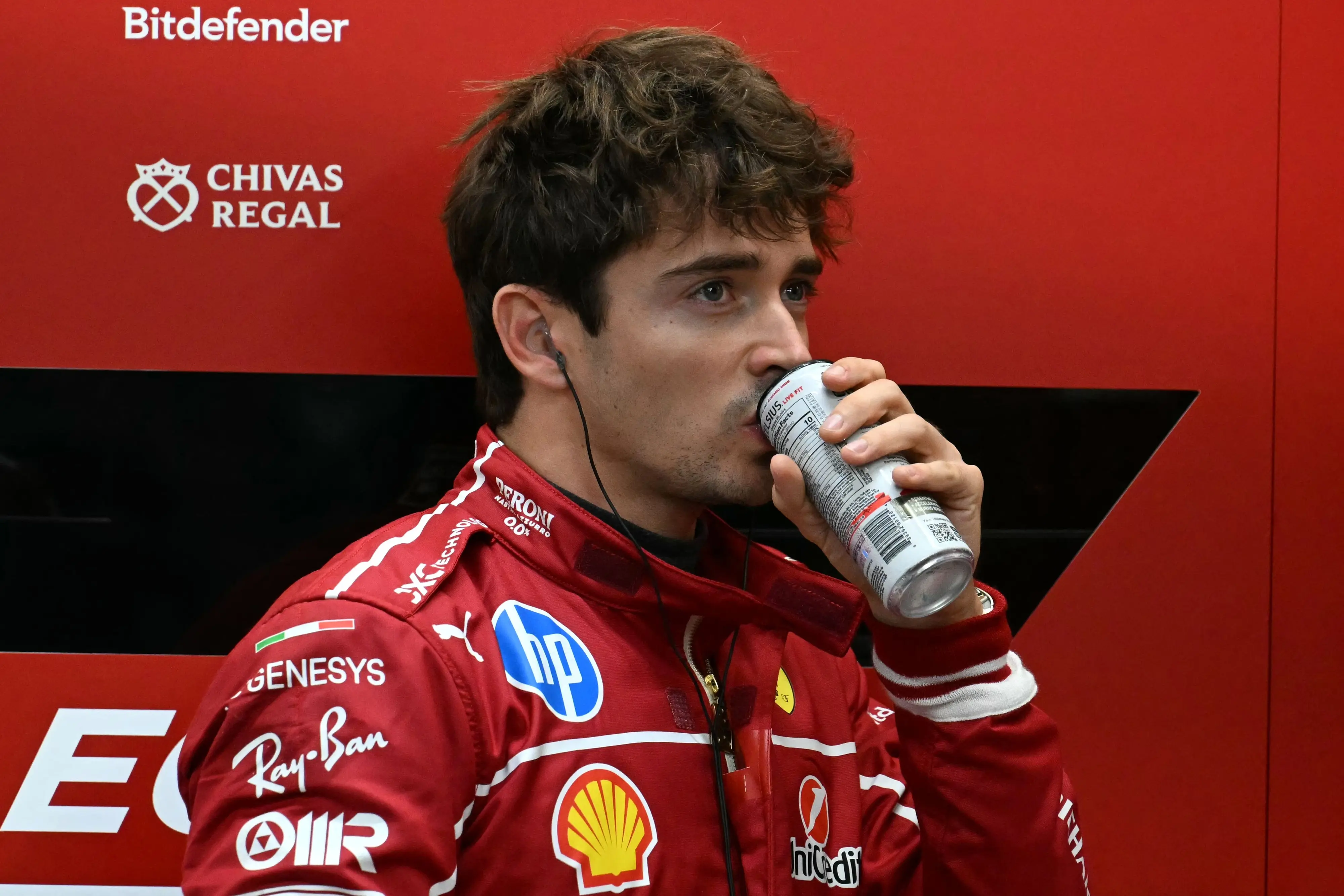 Ferrari's Monegasque driver Charles Leclerc drinks before the second practice session ahead of the Formula One Singapore Grand Prix | Photo: AFP