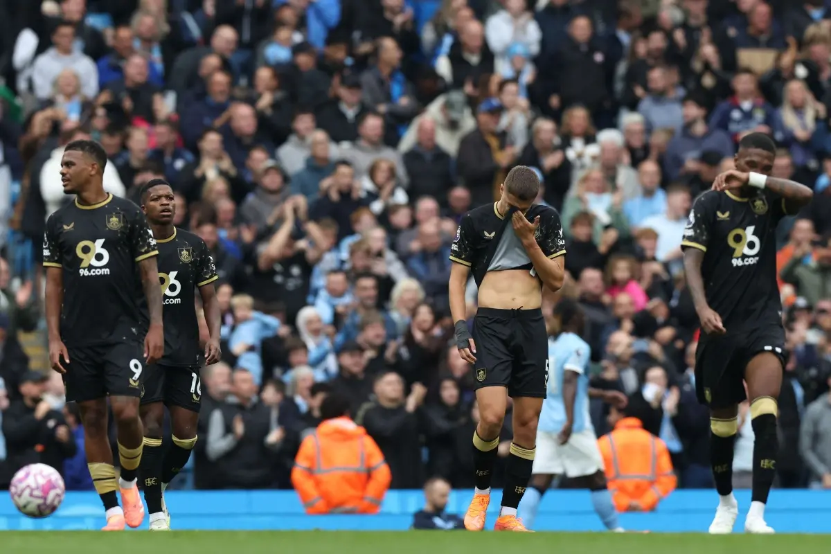 Burnley's players react to conceding their second goal during the English Premier League football match between Manchester City and Burnley at the Etihad Stadium in Manchester, north west England. | Photo: AFP