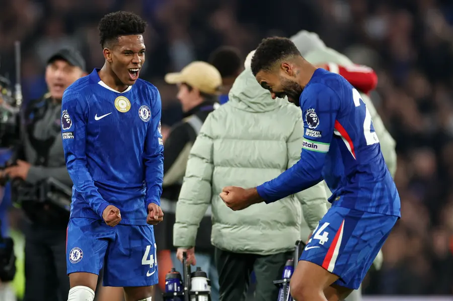 Chelsea's Estevao, left, celebrates with Reece James after the English Premier League soccer match between Chelsea and Liverpool