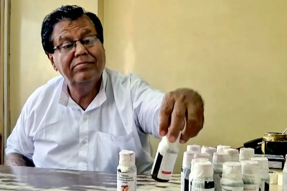 An official inspects bottles of 'Coldrif' cough syrup after a raid following the deaths of 11 children linked to the contaminated medicine, in Jabalpur, Madhya Pradesh. (PTI)