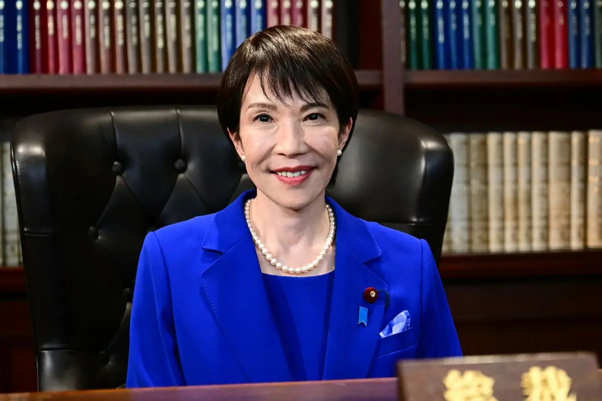 Sanae Takaichi, the newly elected leader of Japan's ruling party, the Liberal Democratic Party (LDP), poses in the party leader's office after the LDP leadership election in Tokyo. Photo: AP