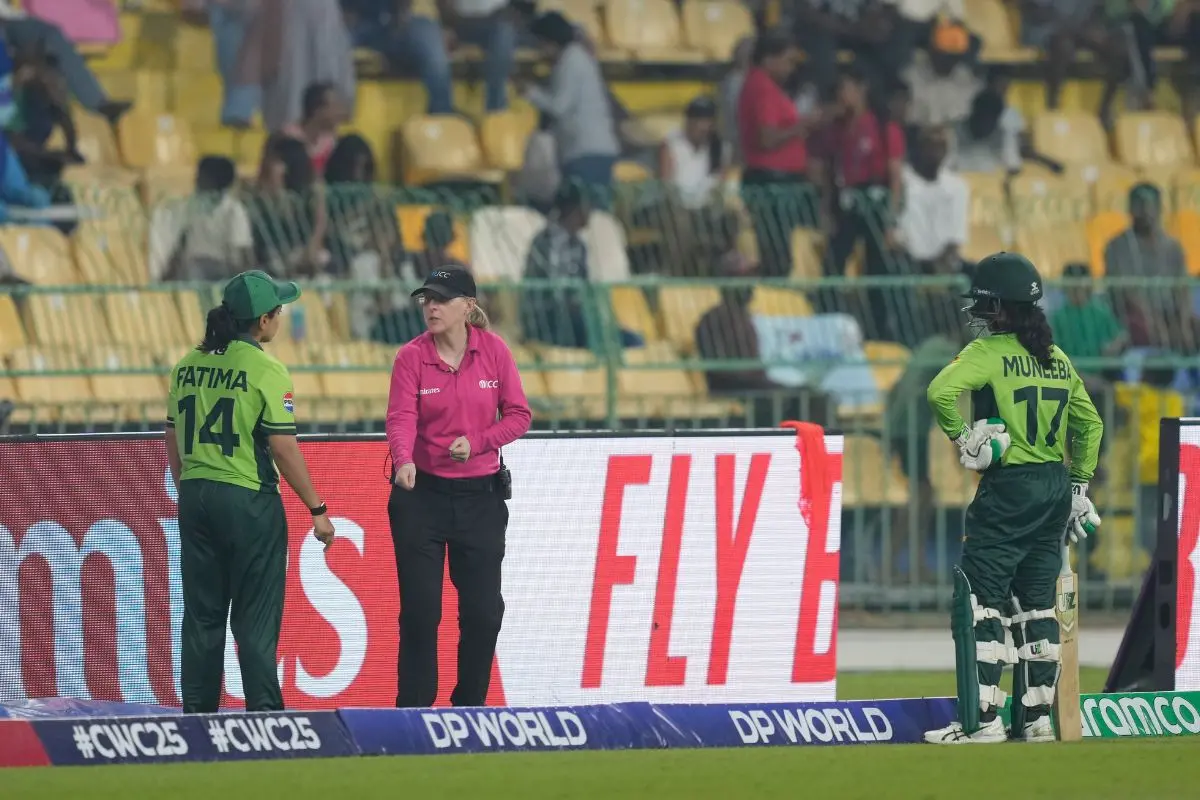 Pakistan's captain Fatima Sana, left, speaks to umpire about the dismissal of Muneeba Ali, right, during the ICC Women's Cricket World Cup match (Photo: AP)