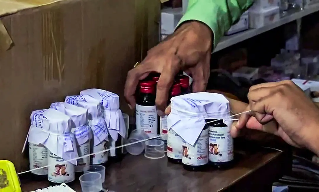 The Drugs Department sealing the Coldrif cough syrup containers after 10 children allegedly die due to consuming it during raid in an Ayush firm, in Chhindwara. | Photo: PTI