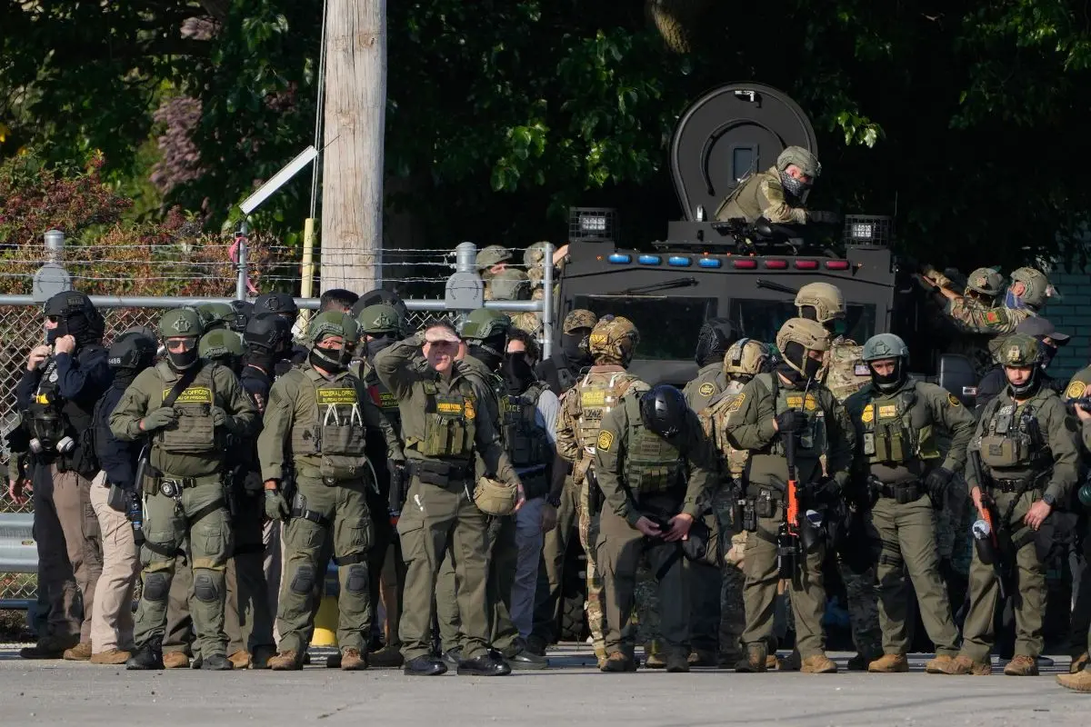 Federal immigration agents near an Immigration and Customs Enforcement facility in Broadview (Photo: AP)