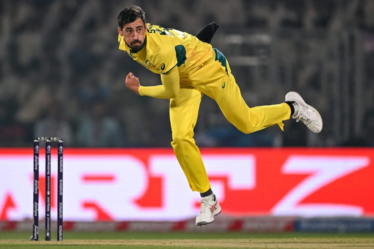 Australia's Mitchell Starc bowls during the 2023 ICC Men's Cricket World Cup one-day international (ODI) match between Australia and Netherlands at the Arun Jaitley Stadium in New Delhi. | Photo: AFP