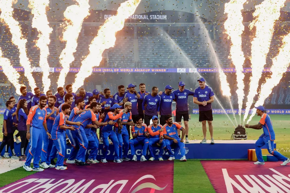 Indian players and team staff celebrate Asia Cup 2025 triumph against Pakistan without the trophy after the Indian team refuses to accept the trophy from Pakistan minister and ACC president Mohsin Naqvi, at Dubai International Cricket Stadium in Dubai. | Photo: ANI